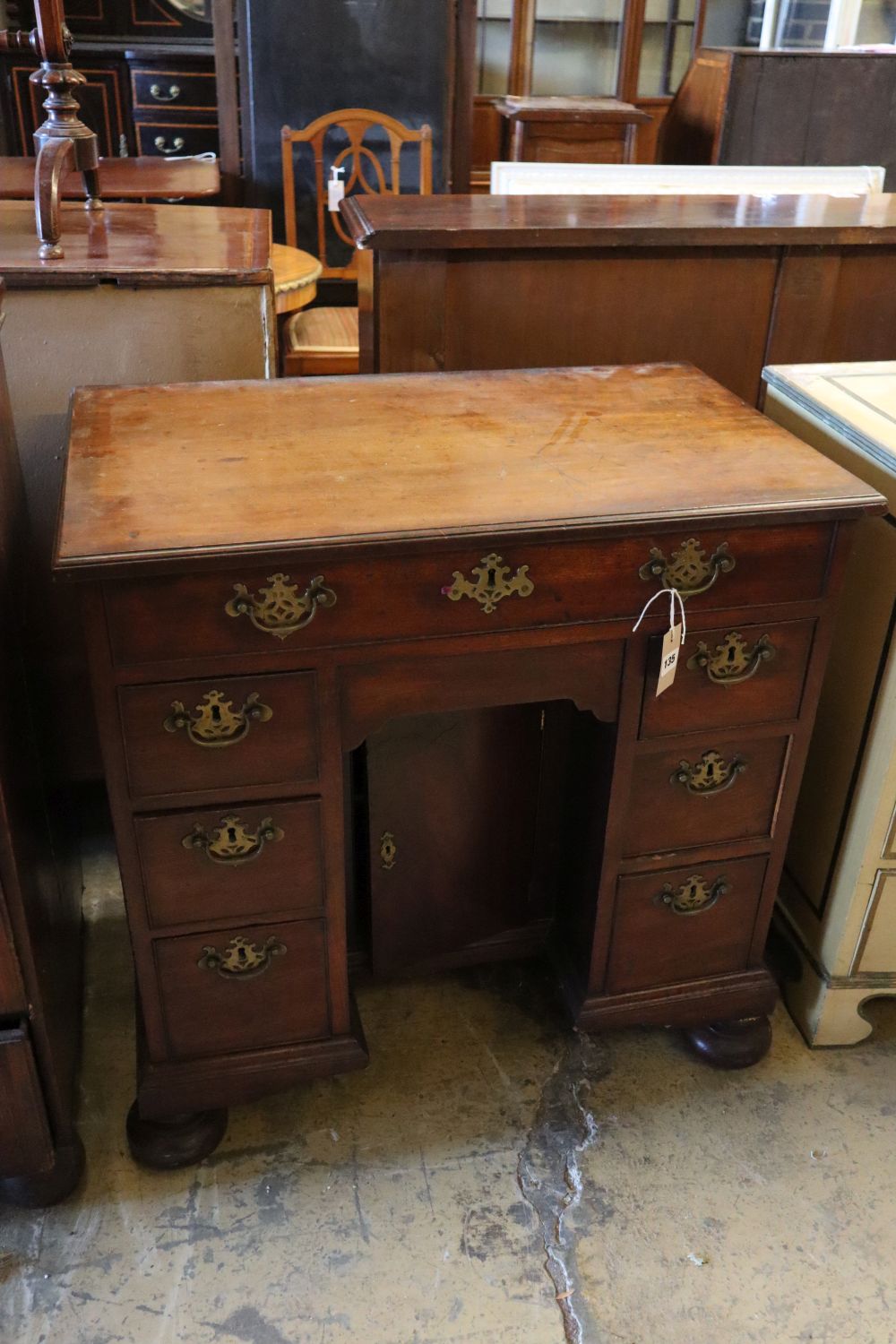 A George II mahogany kneehole desk, width 78cm